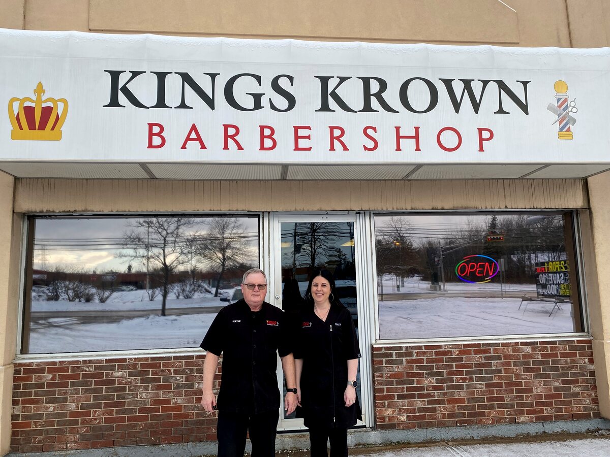 Wayne and Tracy Springer standing outside King's Krown Barbershop on Coverdale Road